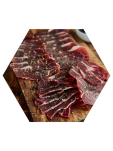 Sliced beef cecina with pepper